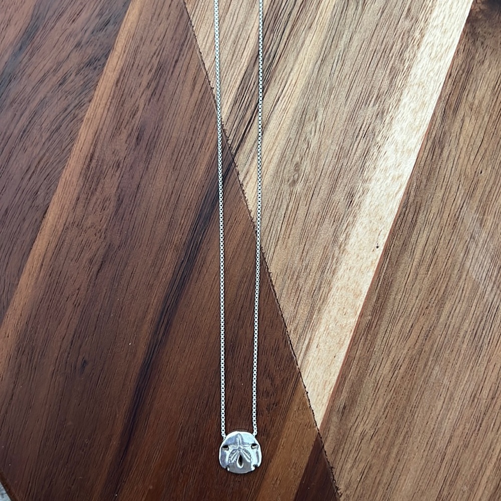 Alex and Ani sand dollar necklace in .925 sterling silver.